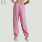 Pink wide-leg fleece-lined sweatpants by SWEATY - Women's back view showing relaxed fit and elastic waistband. Designed for casual wear or lounging, these cozy sweatpants feature a soft fleece interior and cuffed ankles for added comfort.