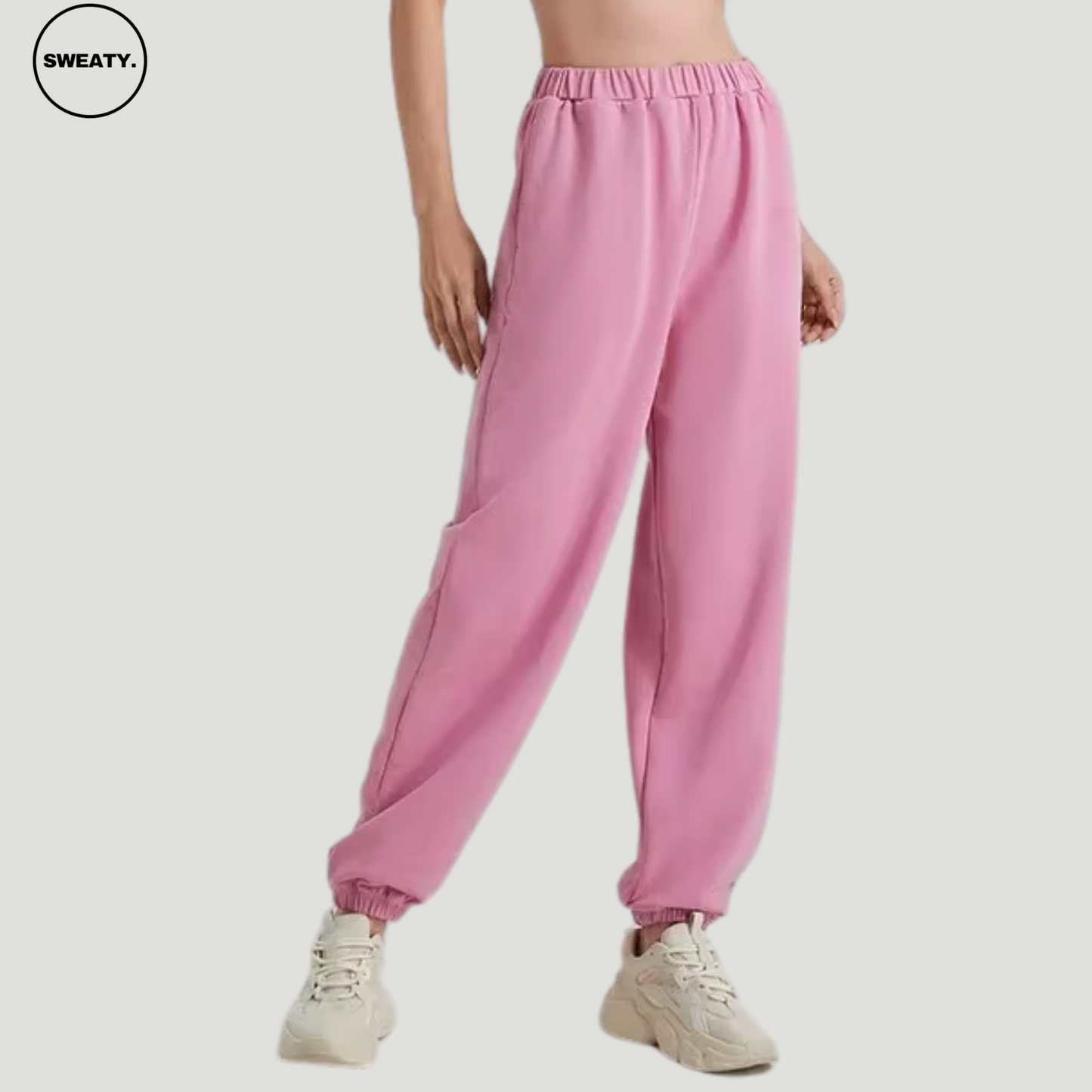 Pink wide-leg fleece-lined sweatpants by SWEATY - Women's cozy and relaxed-fit sweatpants with a soft fleece interior. Ideal for lounging or casual wear, featuring an elastic waistband and cuffed ankles for added comfort and style.