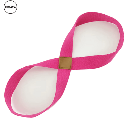 Front view of pink yoga resistance band by SWEATY - a durable and flexible fitness accessory for stretching and resistance training. Made of high-quality elastic fabric for comfort and performance during workouts.