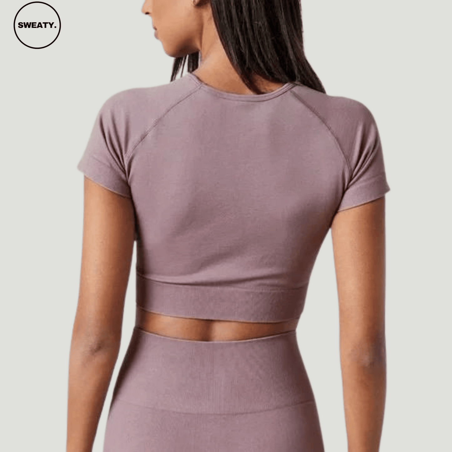 Purple Cropped Breathable Yoga Top by SWEATY - Women's lightweight, moisture-wicking, and breathable cropped top designed for yoga, running, and fitness. Back-angle view of SWEATY activewear top with quick-dry technology for optimal comfort during workouts.