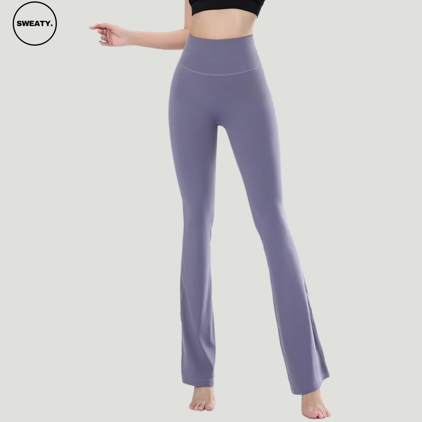 Full-body front view of a model wearing Purple High Waist Slim Yoga Pants by SWEATY, showcasing the flared leg design and high-rise waistband for a flattering and supportive fit. Ideal for yoga or casual wear with its soft, stretchy material.