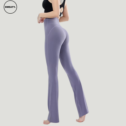 Purple High Waist Slim Yoga Pants by SWEATY - Side view of women's comfortable, form-fitting yoga pants with a high waist for enhanced support. Ideal for yoga, fitness, and casual wear. SWEATY activewear features moisture-wicking fabric for comfort during workouts.