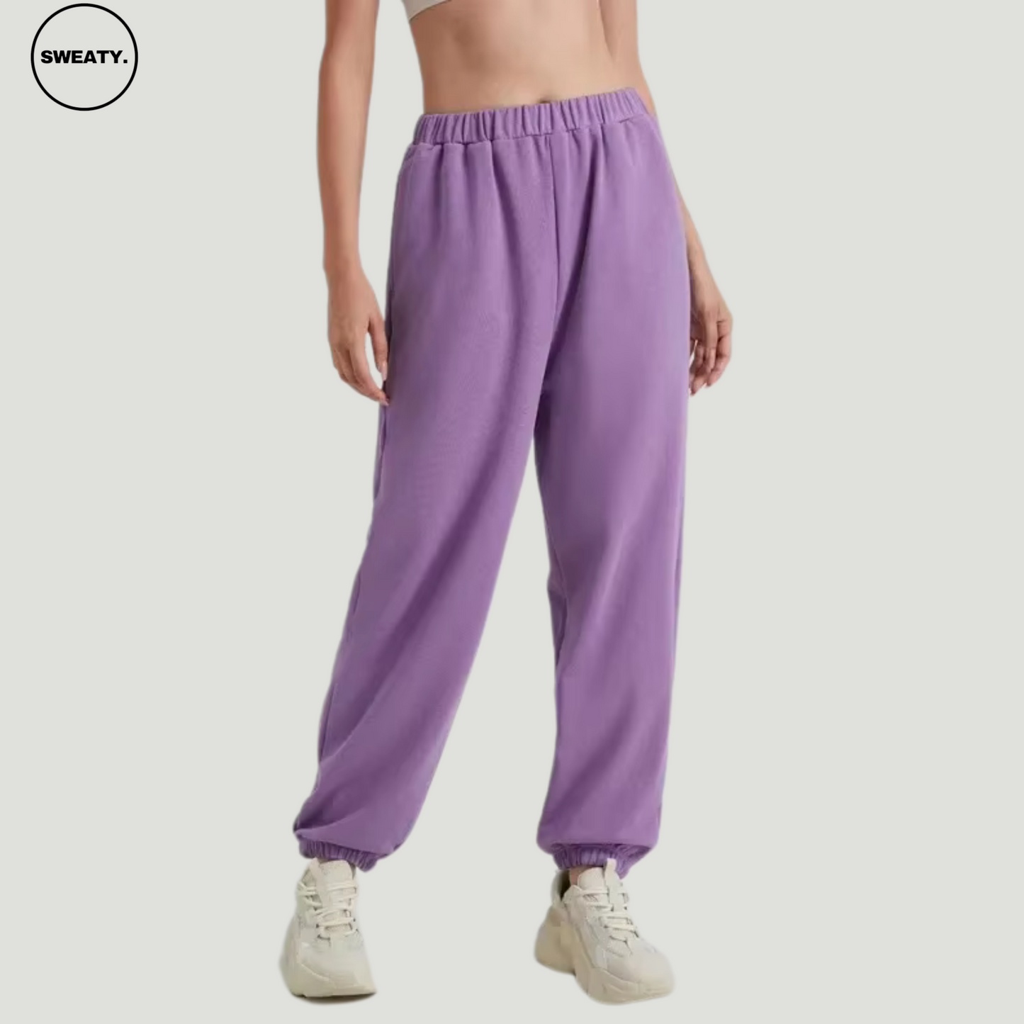 Purple wide-leg fleece-lined sweatpants by SWEATY - Women's relaxed-fit sweatpants featuring a soft fleece interior and front view. Ideal for casual wear or lounging, these pants come with an elastic waistband and cuffed ankles for comfort and style.