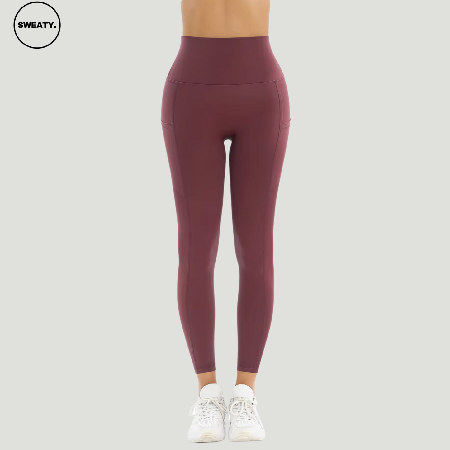 Red Merlot Tummy Control Yoga Pants by SWEATY - Front view showing high-waisted design with side pockets. Crafted from soft, breathable, and moisture-wicking fabric ideal for yoga, gym workouts, and daily wear. Provides a flattering fit with excellent stretch and tummy control for optimal comfort.