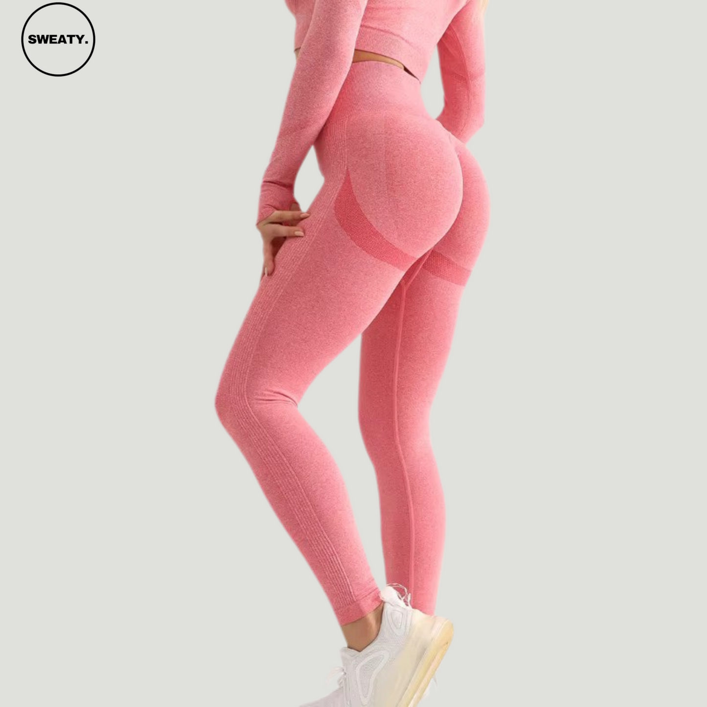 Side angle of Red seamless high-waist leggings by SWEATY, highlighting the body-hugging fit and contouring details for a flattering silhouette.