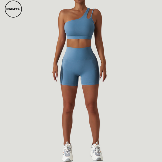 Sky blue Scrunch Workout Two-Piece by SWEATY - Women's breathable workout set with a one-shoulder crop top and shorts, designed for yoga, running, and fitness. Made with sweat-wicking and quick-dry fabric for optimal performance during exercise.

