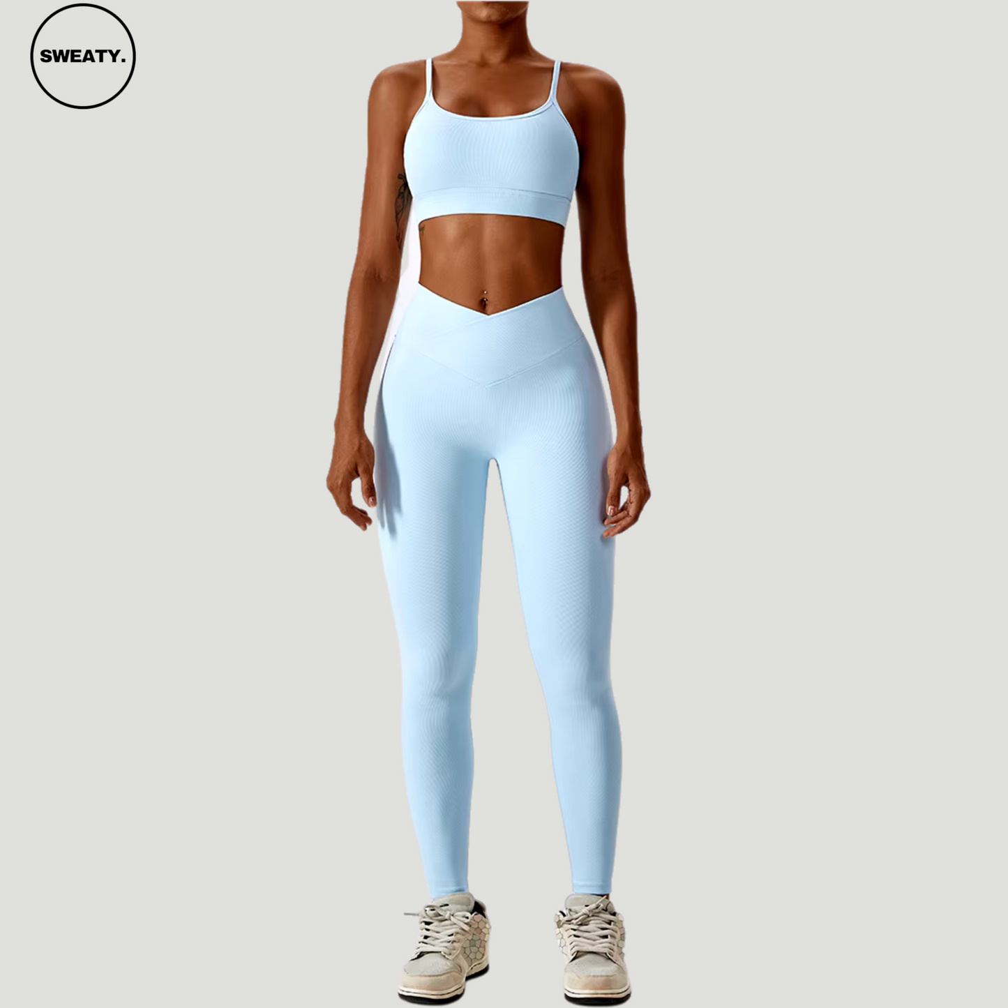 Sky Blue seamless sportswear set by SWEATY – front view of the high-neck sports bra and high-waisted flare leggings. Designed for optimal comfort during yoga and fitness with breathable, moisture-wicking fabric.