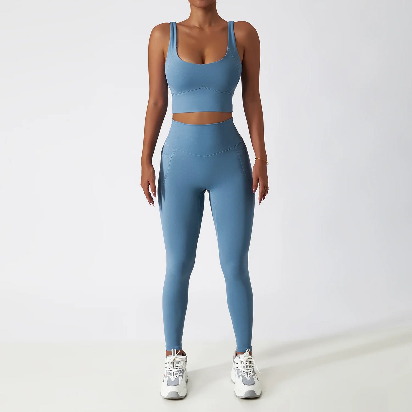 Sky blue seamless tracksuit set by SWEATY - Women's high-waisted leggings and matching supportive sports bra, made with breathable and moisture-wicking fabric. Perfect for yoga, running, and fitness sessions, providing comfort and flexibility during workouts.