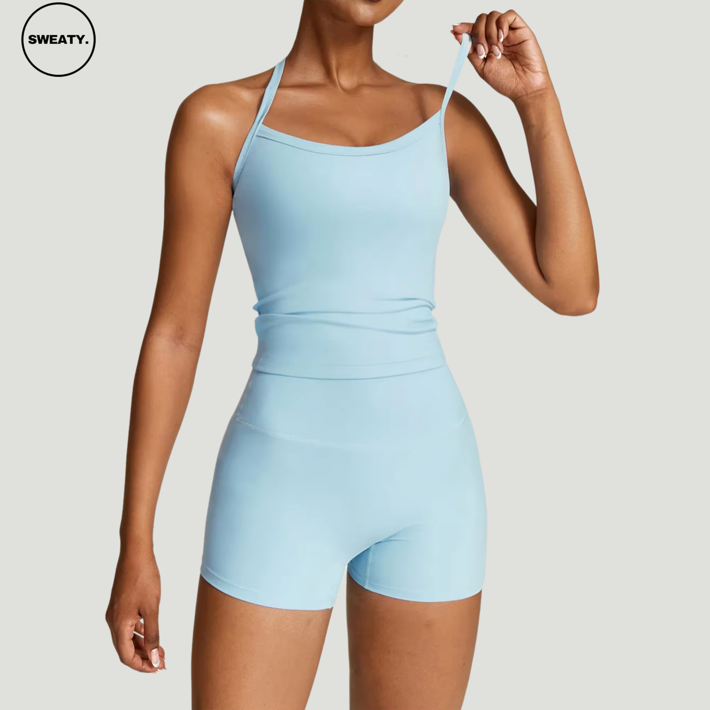 ky Blue seamless yoga set by SWEATY – women’s athletic wear with moisture-wicking fabric, featuring a fitted tank top with thin straps for comfortable yoga and fitness workouts.