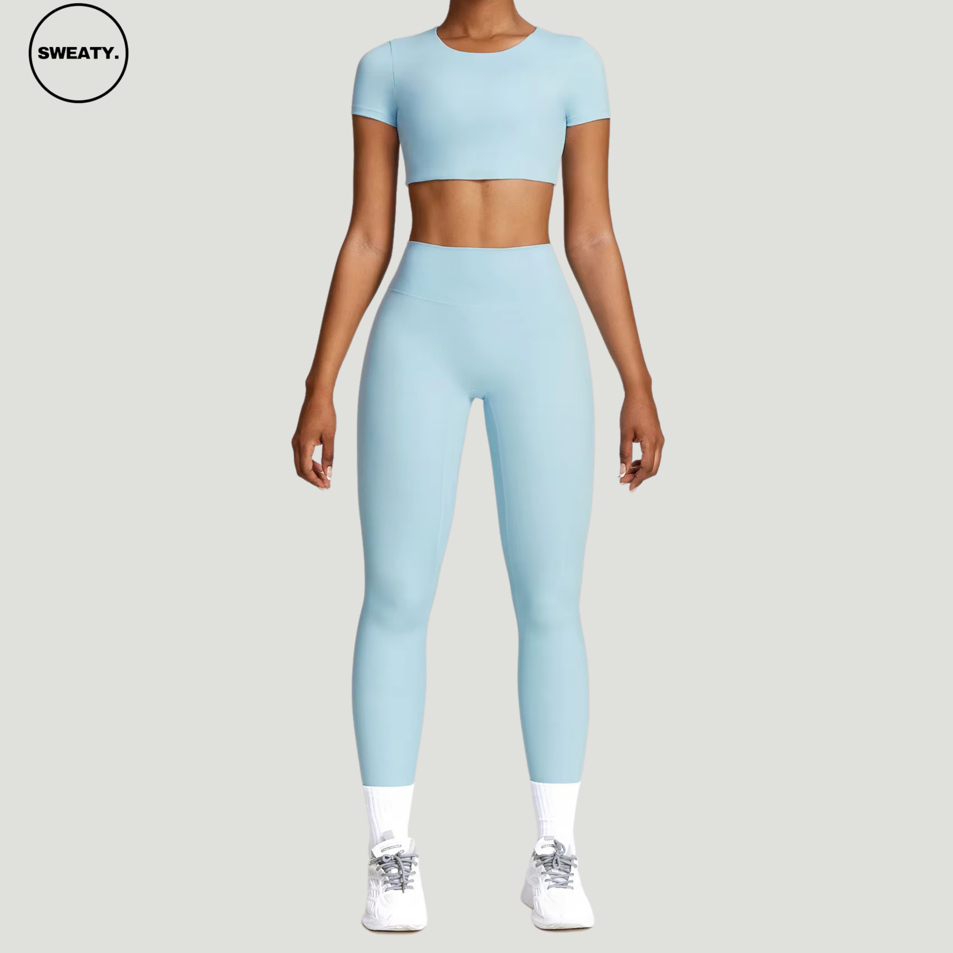 Sky Blue seamless yoga set by SWEATY – full-body view showcasing the matching crop top and high-waisted leggings. Designed with breathable, moisture-wicking fabric, ideal for yoga and fitness routines.