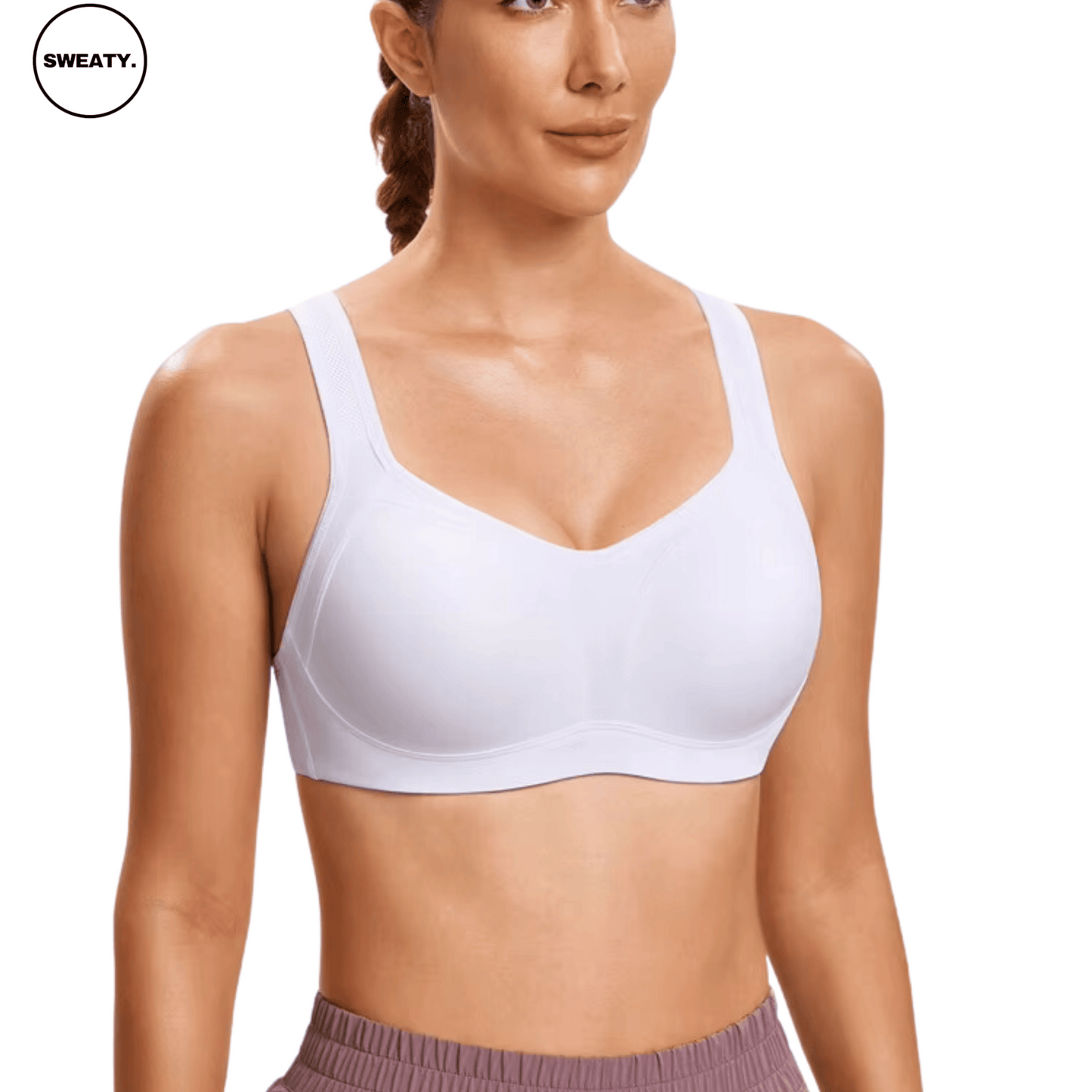 Angled front view of White Supportive Sports Bra by SWEATY, showcasing a seamless, comfortable fit with wide straps and underwire support designed for high-impact activities.