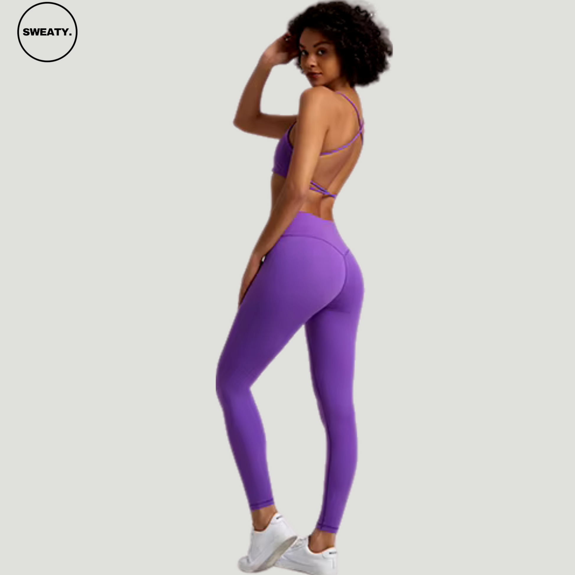 Wisteria Flower Buttery Soft Gym Set by SWEATY - Women's lightweight, flexible leggings and sports bra in vibrant purple, showcasing a slim fit with strategic cutouts for enhanced breathability and style. Ideal for yoga and high-intensity workouts.