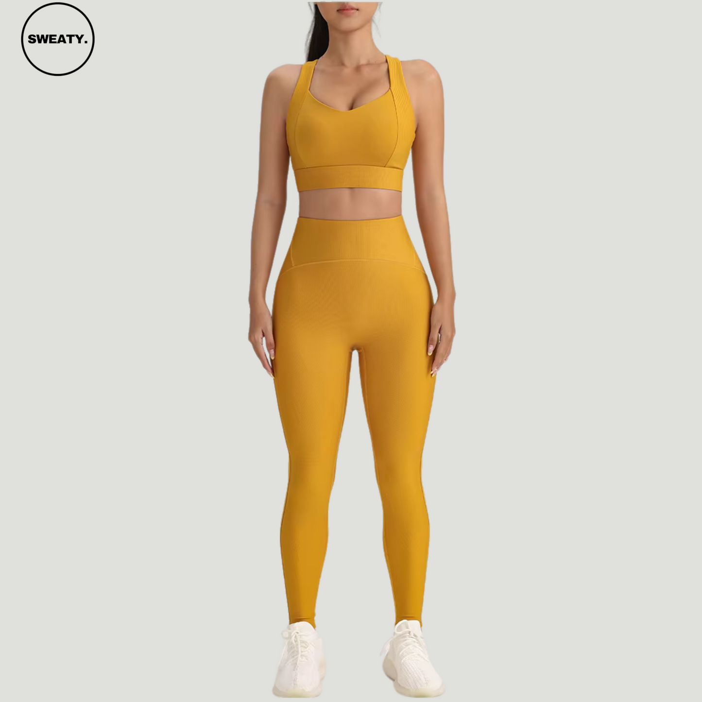 Yellow-Cross-Yoga-Set-Front-View-by-SWEATY - Women's bold and vibrant Yellow Cross leggings and sports bra, featuring an elegant cross-back design for enhanced support and style during fitness activities. Perfect for those looking to stand out in the gym with both color and performance.