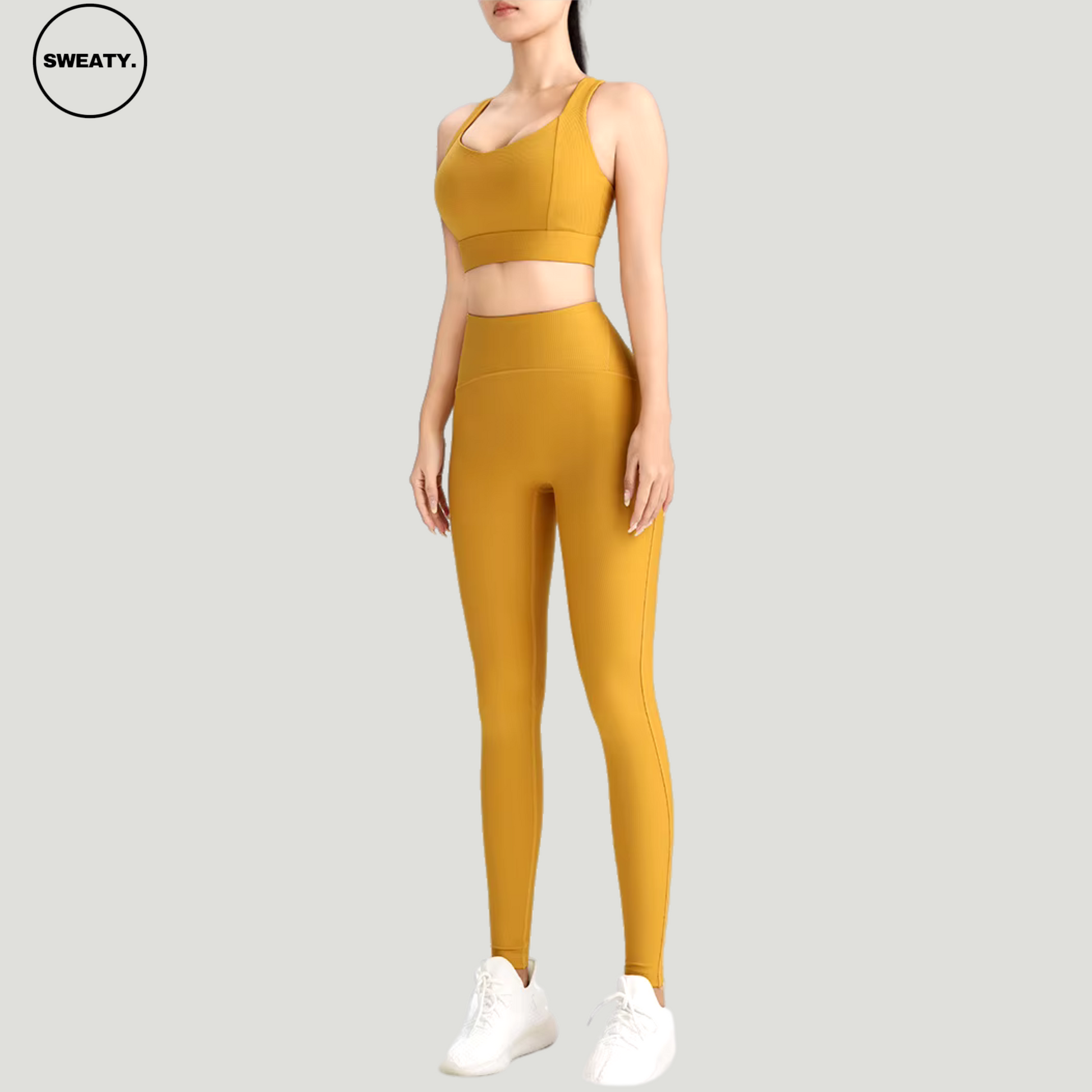 Yellow-Cross-Yoga-Set-Side-View-by-SWEATY - Women's bold and vibrant Yellow Cross leggings and sports bra, featuring an elegant cross-back design for enhanced support and style during fitness activities. Perfect for those looking to stand out in the gym with both color and performance.