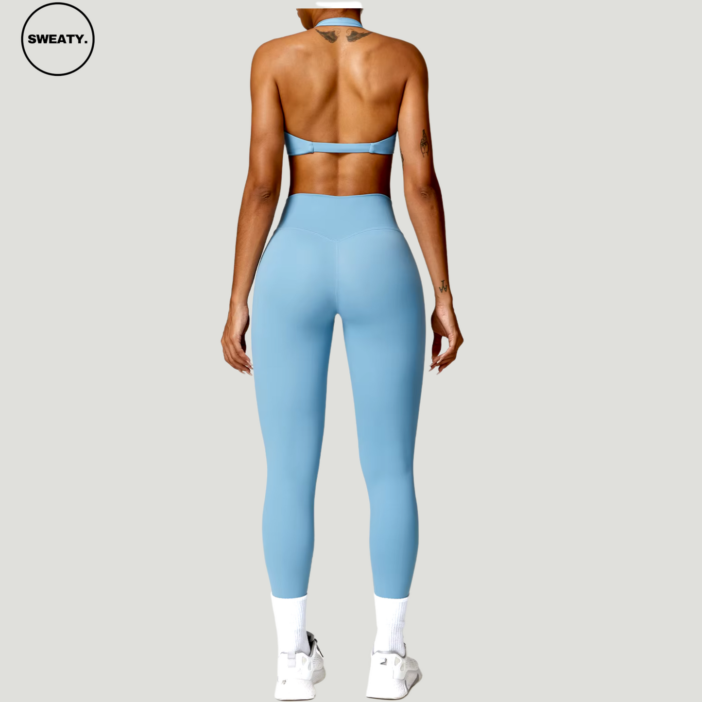 Back view of Blue Nude Feeling Yoga Set by SWEATY – Women’s seamless, breathable activewear set featuring a halter-neck top and high-waist leggings. Ideal for yoga, fitness, and workout routines.