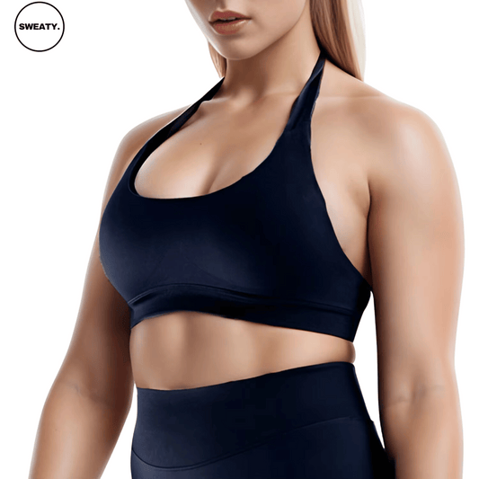 Black Halter Neck Yoga Bra by SWEATY - Women's supportive, moisture-wicking, and breathable halter neck bra designed for yoga and fitness. SWEATY activewear shown from the side angle, providing comfort and flexibility during workouts.