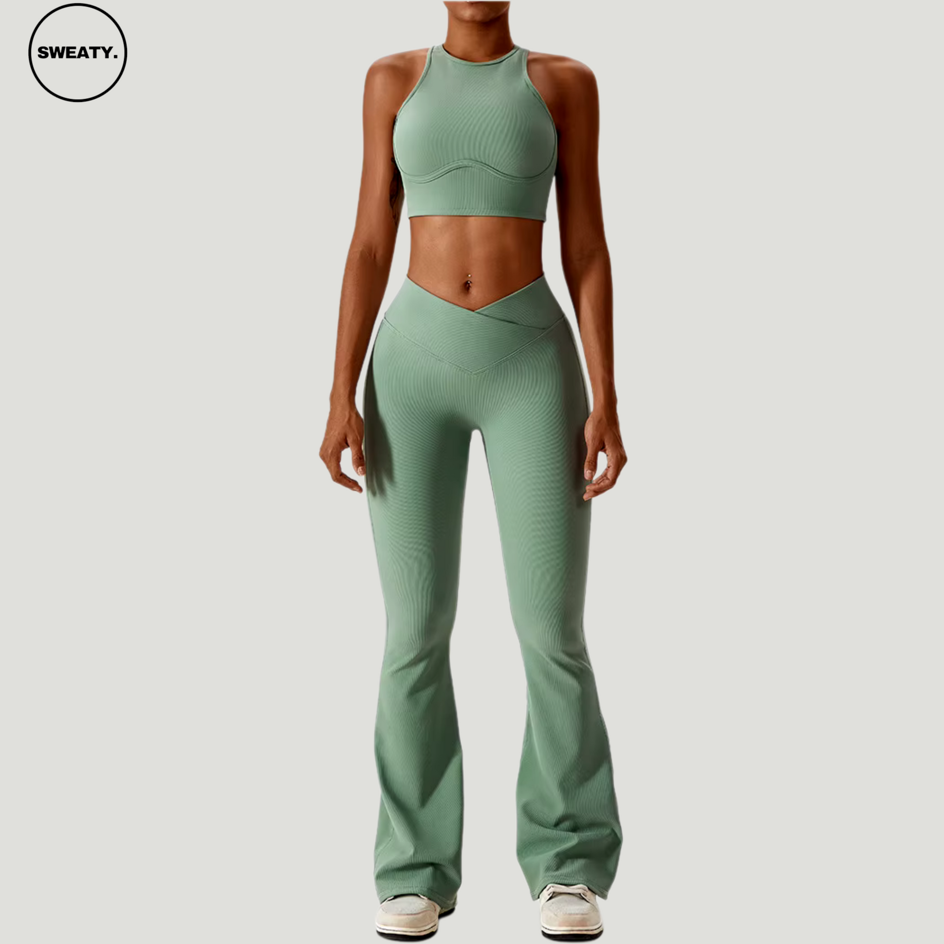 Green seamless sportswear set by SWEATY – full front view of the high-neck sports bra paired with high-waisted flare leggings. Perfect for yoga and gym workouts, with quick-dry, breathable fabric for performance and comfort.