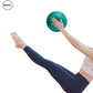 Woman performing Pilates exercise using a turquoise yoga ball, balancing the ball in her hands while keeping her legs extended for core strengthening.